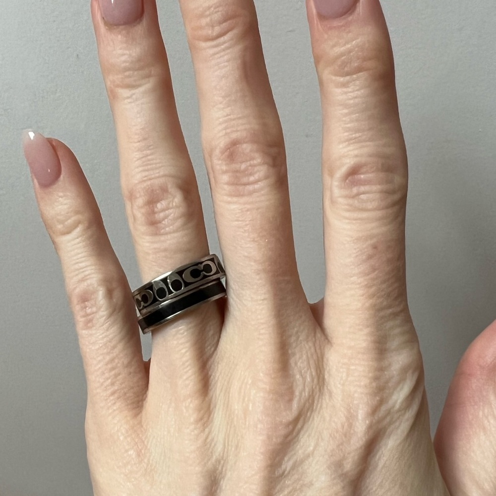 Coach black and silver ring set.